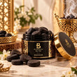 Bloom Scent Bakhoor jar with traditional incense pieces in a light modern Arabic setting for home fragrance