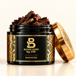 Bloom Scent Bakhoor product display with black and gold jars, oud wood and traditional Arabian incense burner